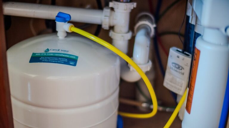 Carroll Water treatment equipment under a sink