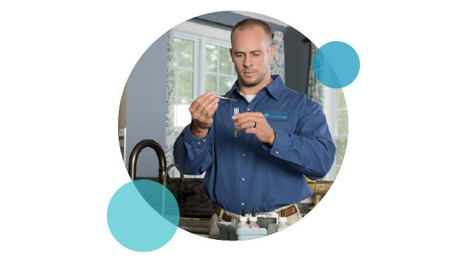 Carroll Water technician performing a water test
